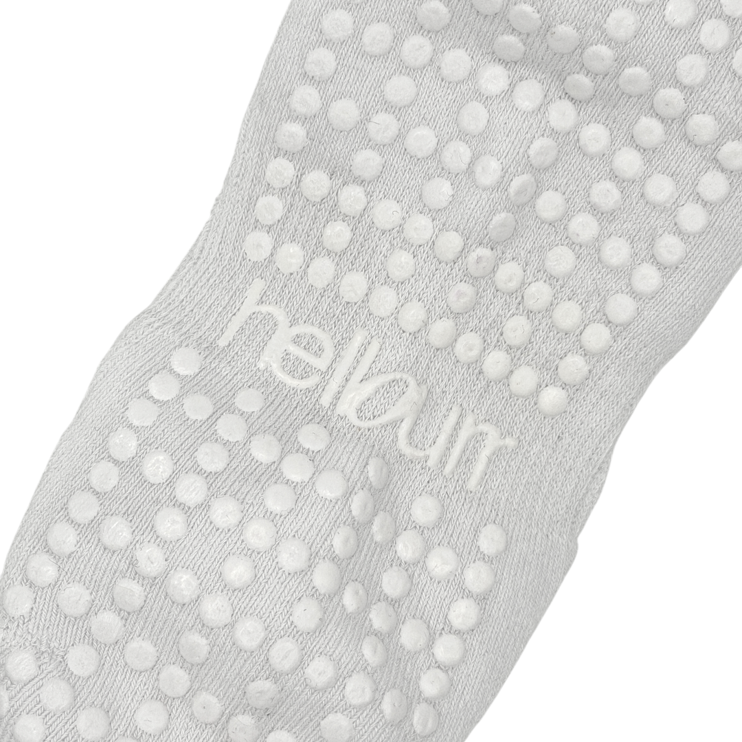 close up of custom grip on white 'hellourr' ballet grip socks