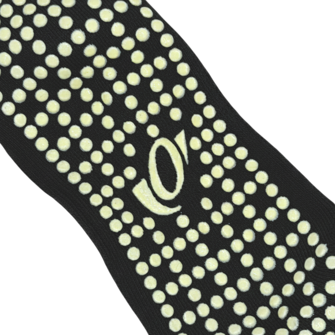 Close-up of hellourr pilates socks showing honeycomb silicone grip pattern on the sole for non-slip traction on a reformer.
