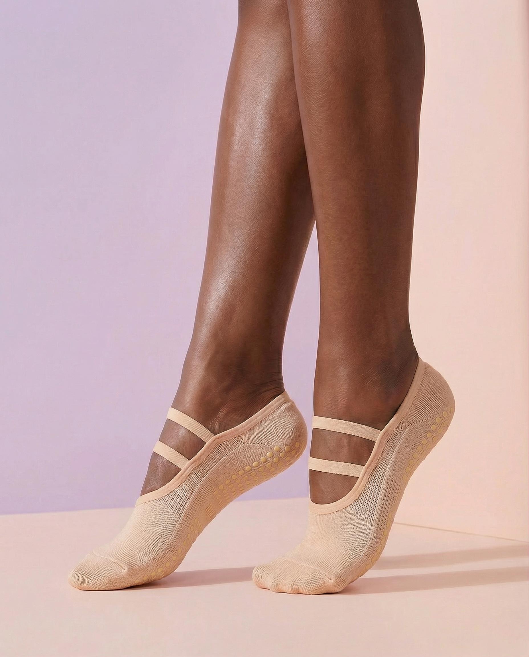 peach ballet grip socks on foot