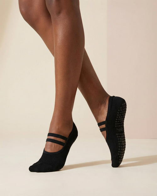 person wearing black ballet grip socks