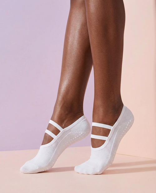 white ballet grip socks on foot