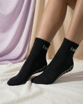 black hellourr pilates socks on foot