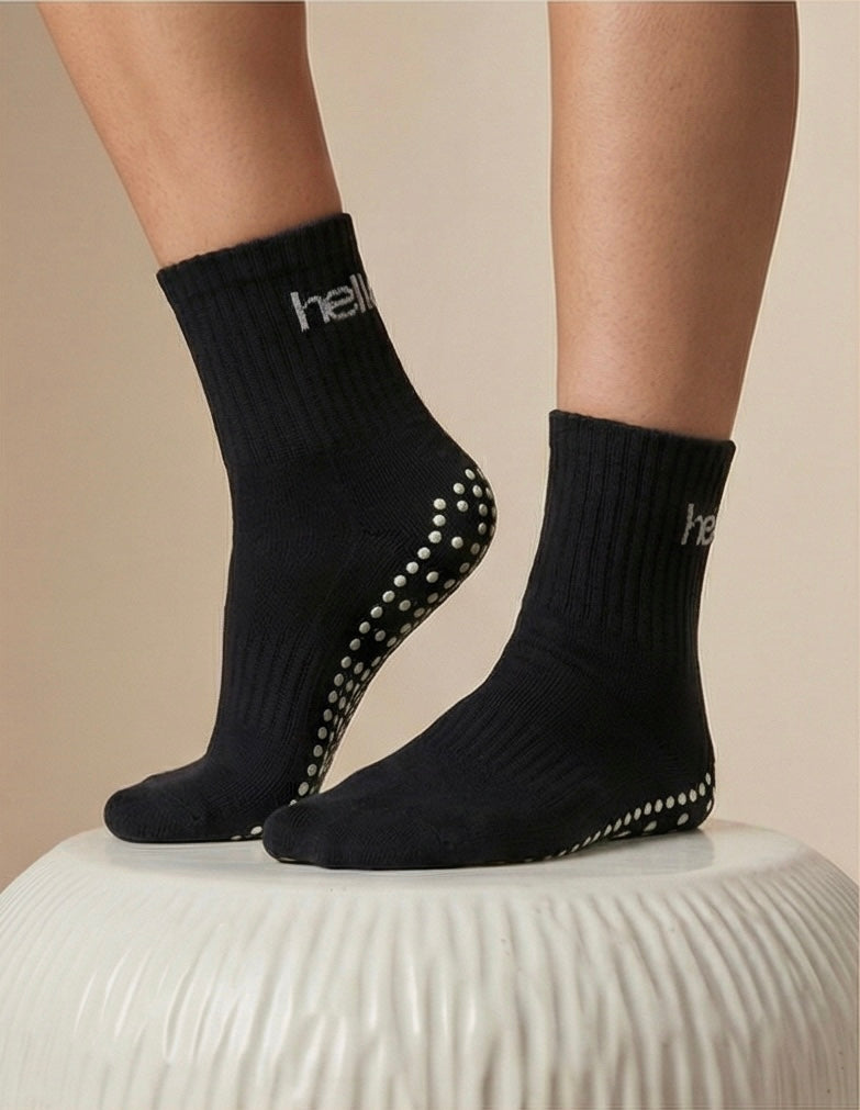 model wearing black hellour midcrew grip socks