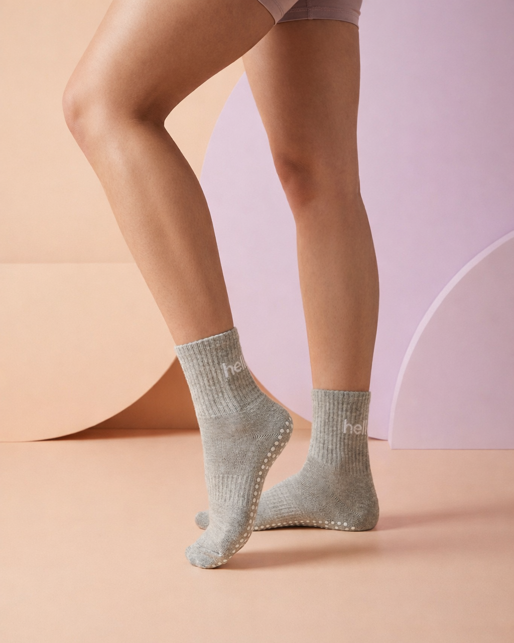 model wearing grey hellour midcrew grip socks