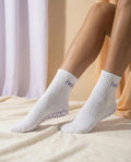 white purple hellourr midcrew grip socks on foot