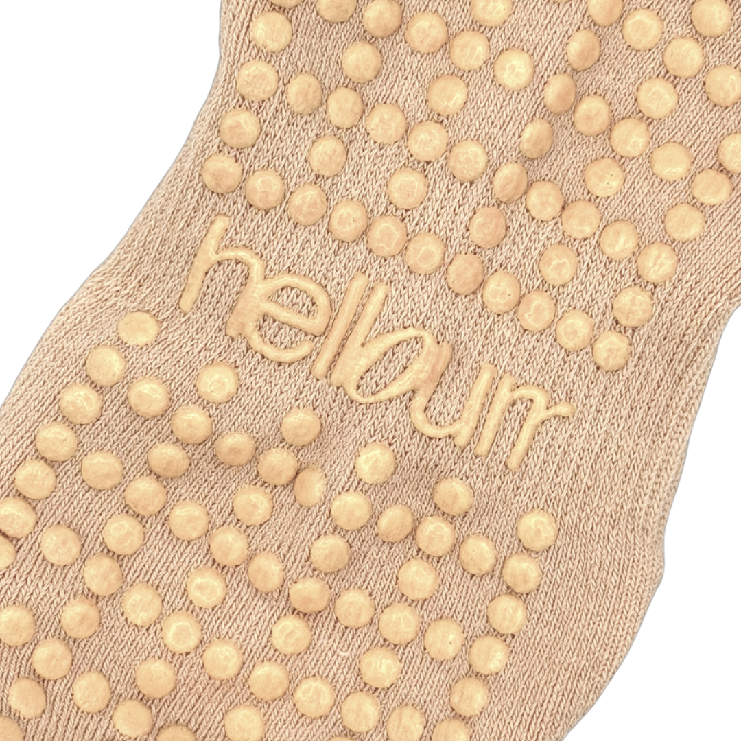 Close-up of ballet socks with custom hellourr grip pattern
