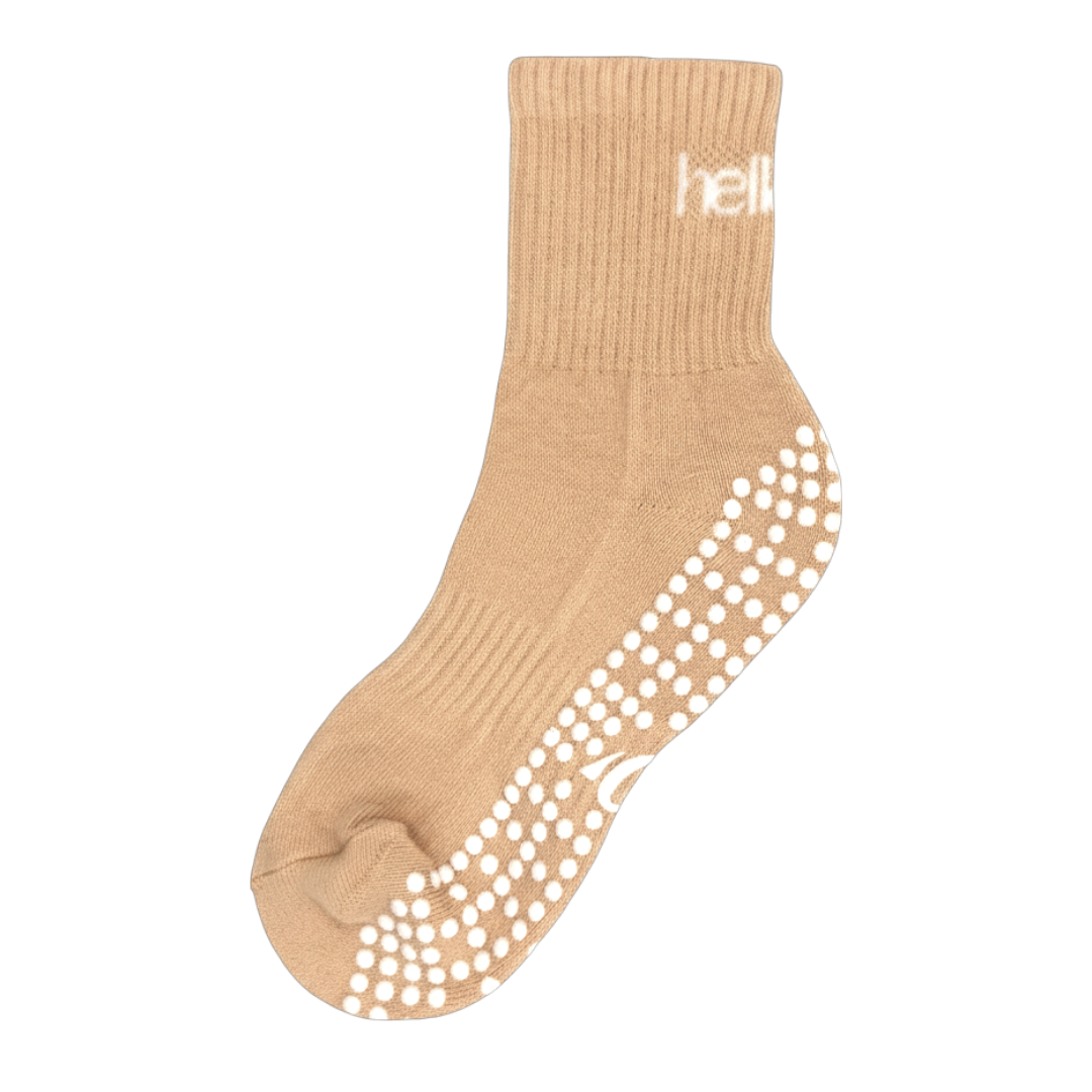 Pair of peach cotton-mix pilates socks with reinforced arch support and breathable mesh top, flat lay.