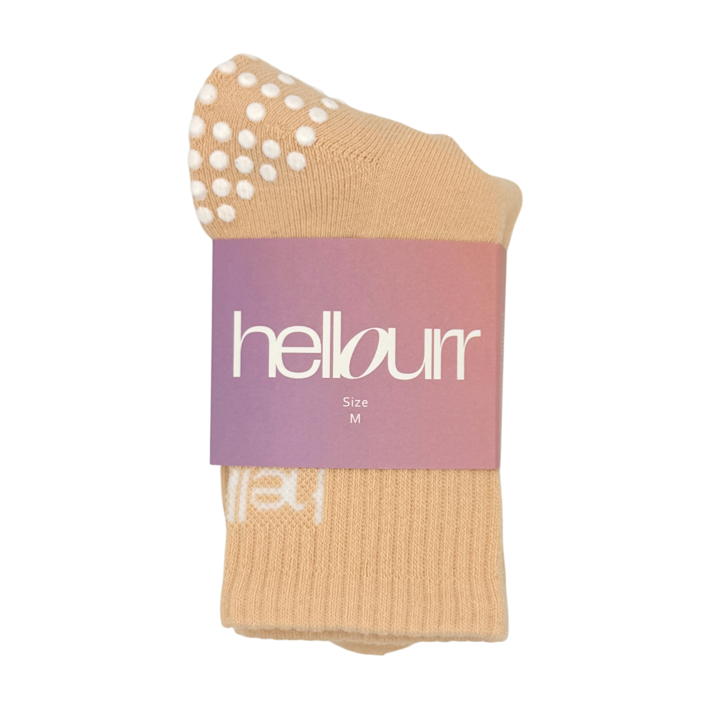 peach midcrew grip socks in 'hellourr' packaging