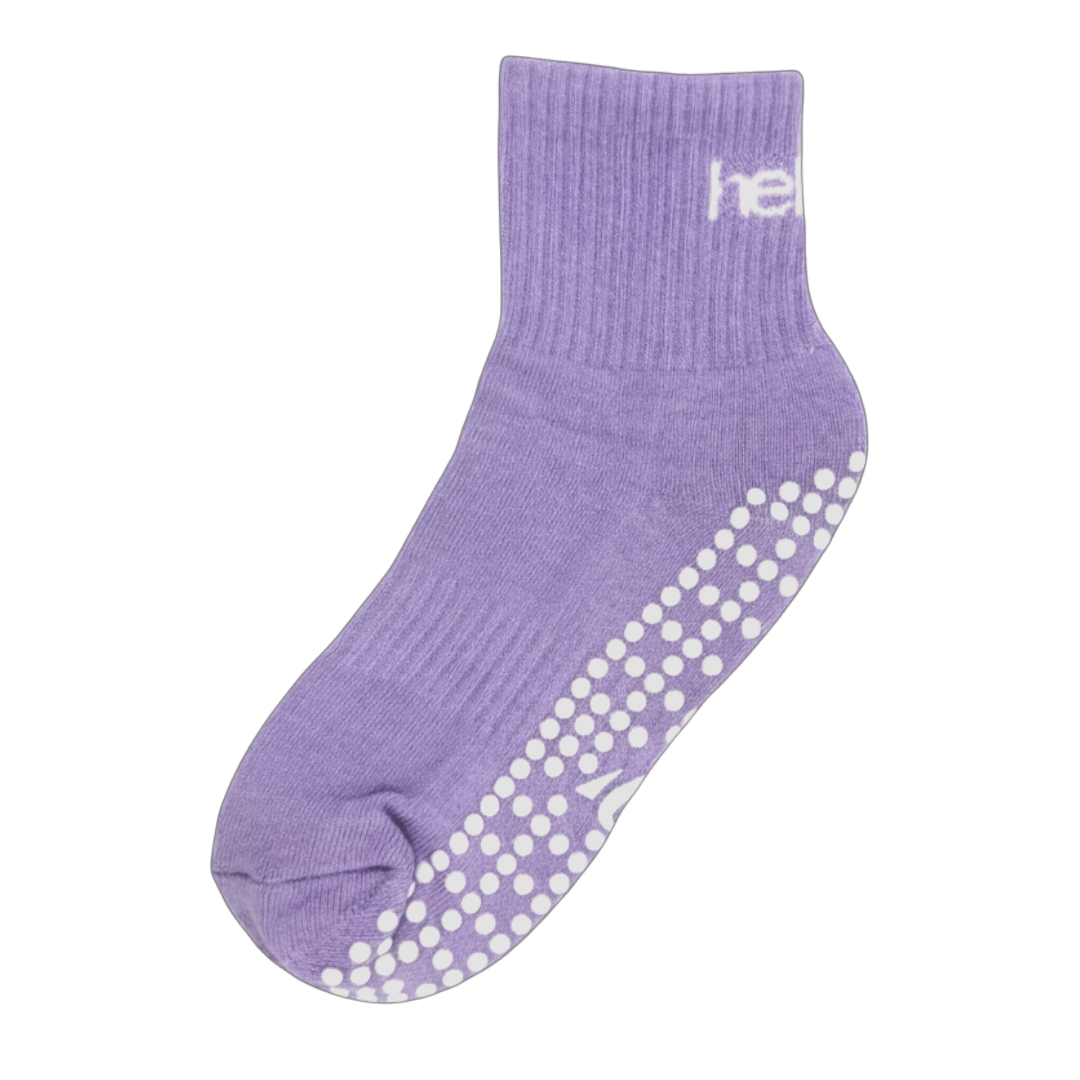 Pair of purple cotton-mix pilates socks with reinforced arch support and breathable mesh top, flat lay.