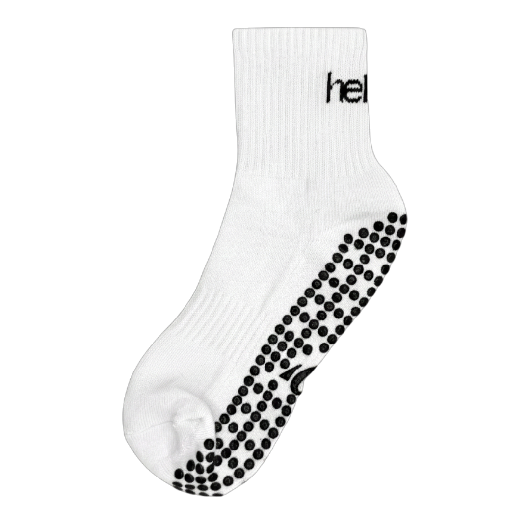 Pair of white cotton-mix pilates socks with reinforced arch support and breathable mesh top, flat lay.
