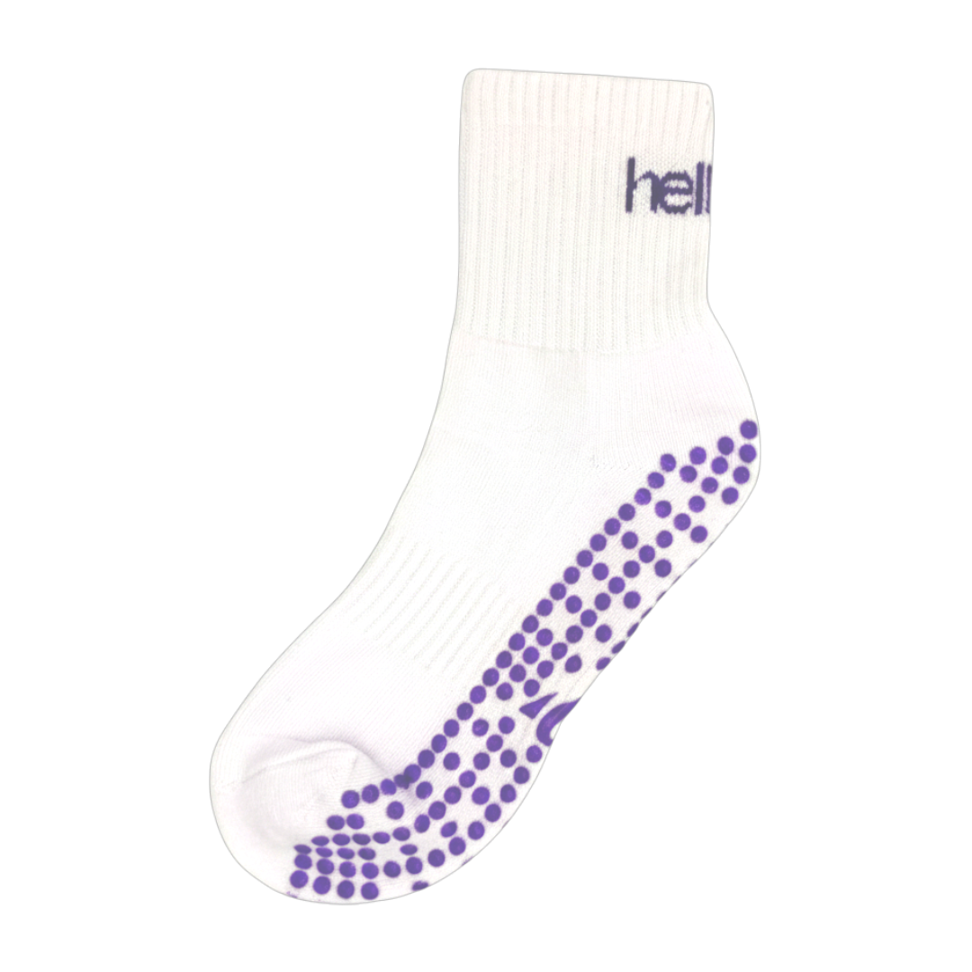 Pair of white cotton-mix pilates socks with reinforced arch support and breathable mesh top, flat lay.